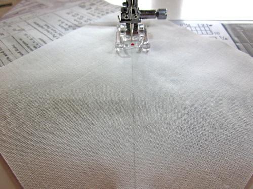 Stitch along the drawn diagonal line, taking care not to stretch the fabric as