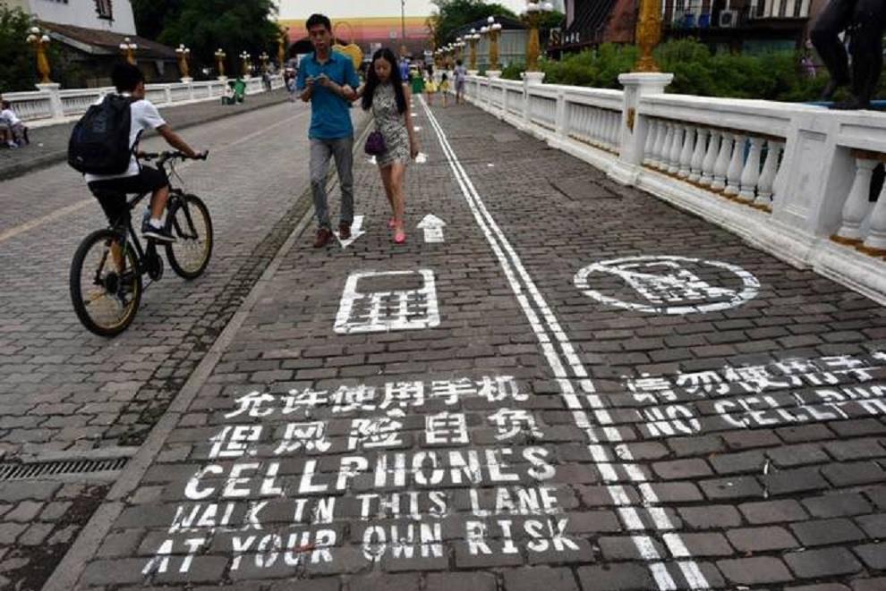 com/news/social-affairs/pedestrians-using-mobile-phones-indanger-of-falling-into-zombie-trance-1.