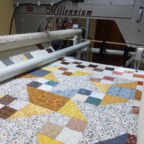 I had a good backing for it. It s light with a darker tan accent. I think it s going to look good. My intention this night was to get the quilt loaded and work on it the next day.