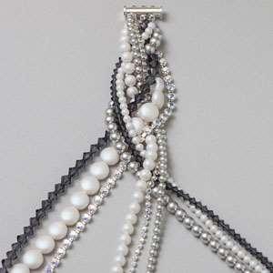 Use one bead stopper to secure the first two strands, a second