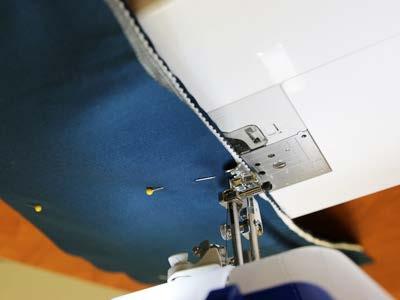 Sew a seam along each long edge, sewing as close to the cord of the trim as