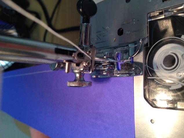 2. Using a paper with a straight edge, sew a ¼ seam on one long
