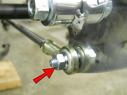 Using an M6-1.0x25 Socket Head bolt and M6 Nut, attach the other end of the linkage to the Shifter Pedal.