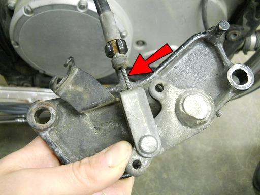 Rotate the brake pedal arm down to expose the inner
