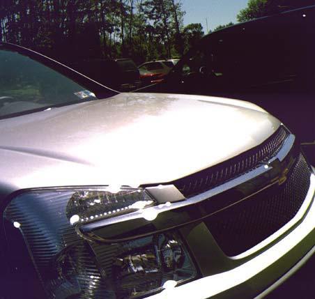 Introduction Figure 1-23 shows a second example of an overexposed picture. The hood of the vehicle is overexposed and there are several bright spots hiding detail.