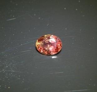 Padparasha rarer sapphire color is a pinkish orange Eye clean. Measures 5.6 x 4.35 mm. Weight is 0.52cts.