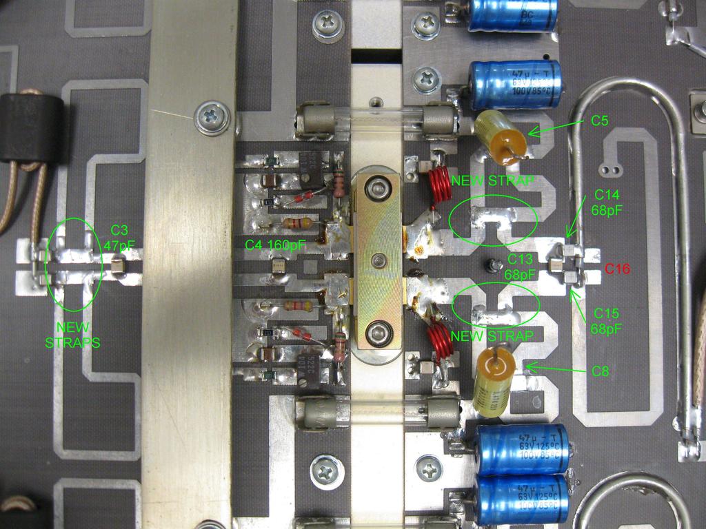 The modified amplifier stage showing the four new bridging straps and locations of the new capacitors.