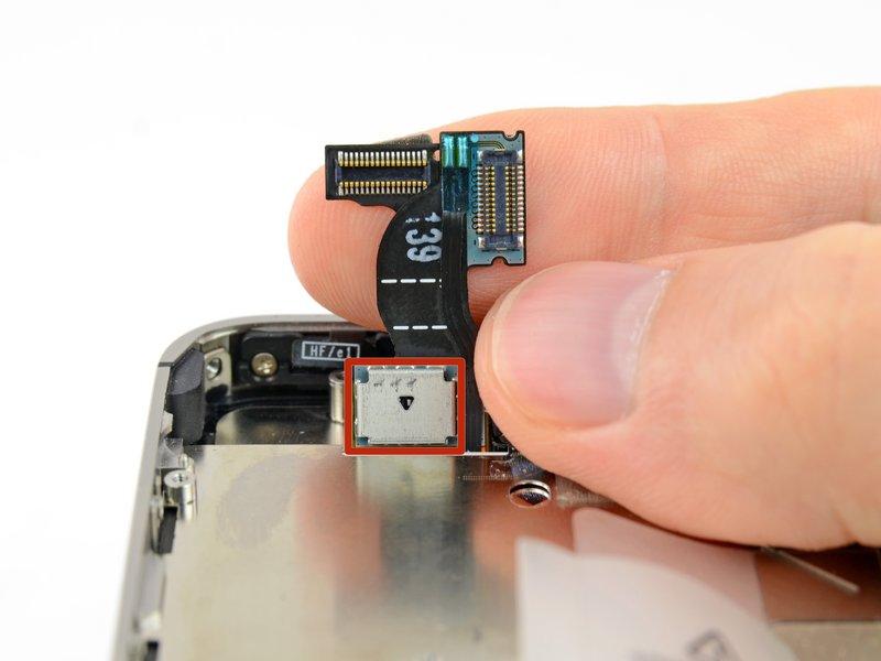 This photo shows the display assembly being installed incorrectly, with a fold in the digitizer cable.