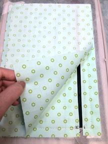 Make sure it covers the entire perimeter of the outermost stitch line. The next step will sew down the back of the zipper pouch. 68.