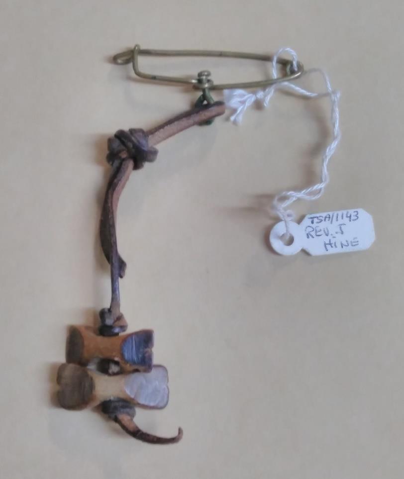 The Rev. Charles Hines attended the pilot course. He later recalled how he received his wood badge created by Baden-Powell using one of the beads from Dinizulu s necklace.