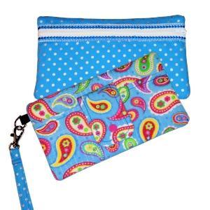The Beth An in-the-hoop project A classic wristlet. Tab on front pocket snaps closed to keep your phone safe. The back zipper opens to reveal 6 credit card slots and room to hold other necessities.