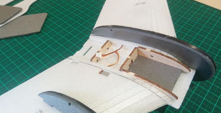 Twist them sideways a little to slip over the front of the wing and then work them up the wing slowly bit by bit into