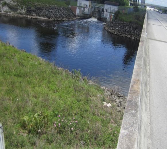 you will see the fence ends so that the Canal can go under the Turnpike. There is a: 53 54 55. 5 Ft.