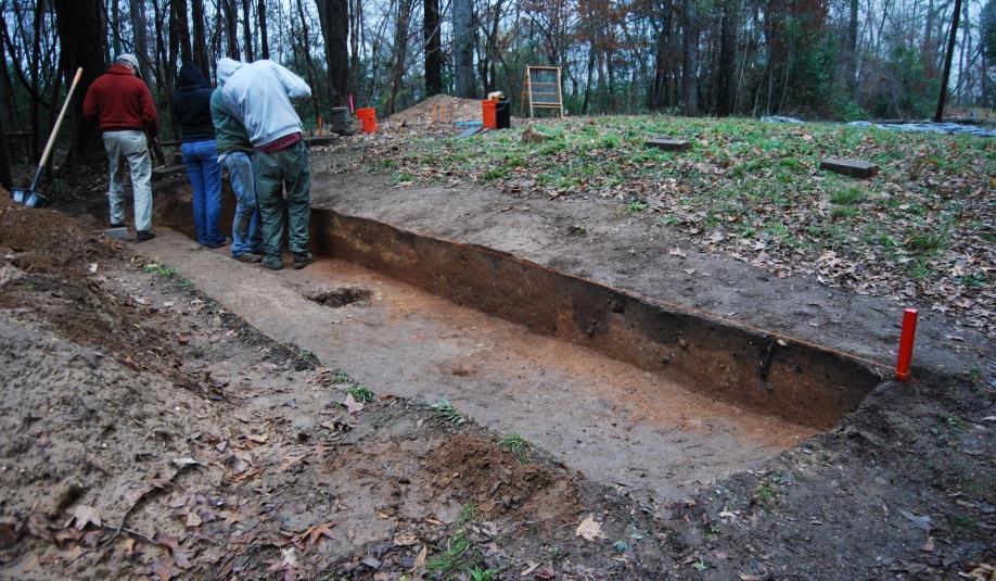 and record the features intruding from the top of the mound. Of the large pit features originally seen in profile, only Feature 52 was excavated due to time constraints. Figure 6.