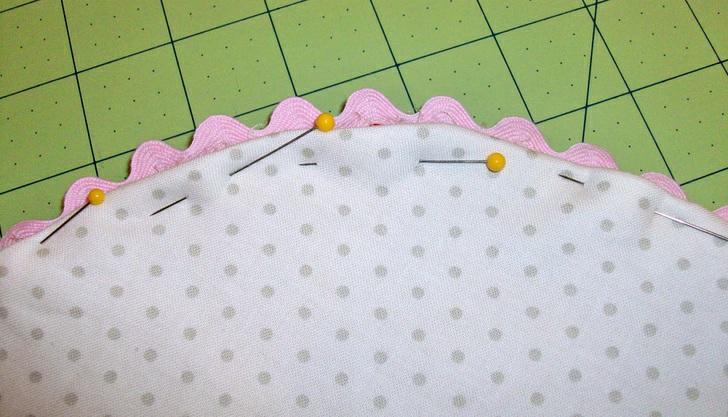needle or point turner, gently smooth out the curved seam. 4. Press well, turning in the raw edges of the opening so they are flush with the sewn seam. Pin the opening in place. 5.