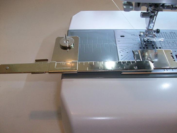 To get a pretty "hand-look" to our quilting stitches, we set up our Janome machine for a hand look stitch, using monofilament thread in the needle and all purpose thread to match our trivet in the