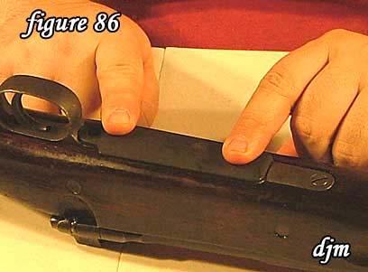 87) Slide the hand guard to the rear of