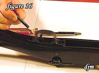 16) Remove the rear guard screw.