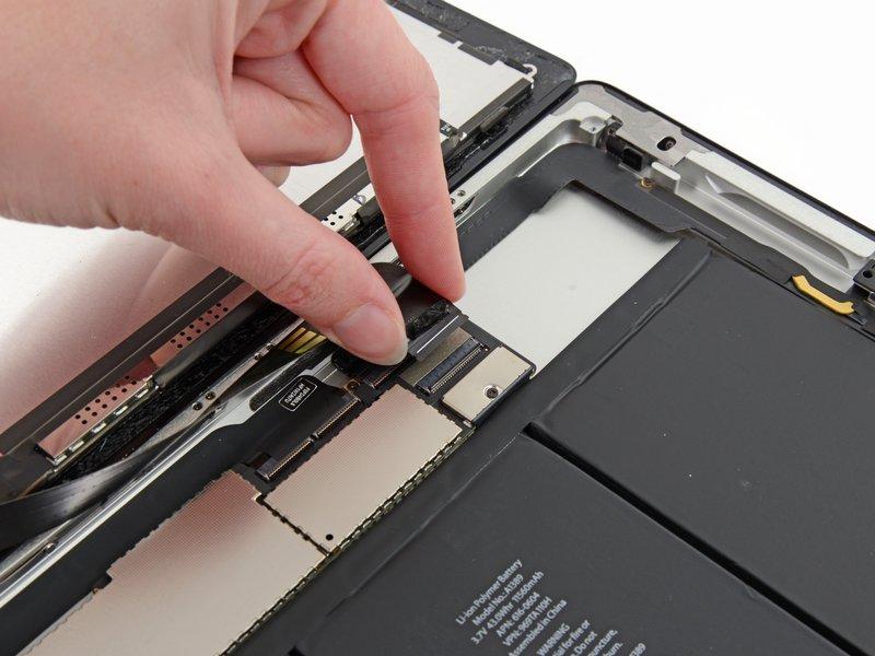 Using your fingers or a pair of tweezers, pull the LCD
