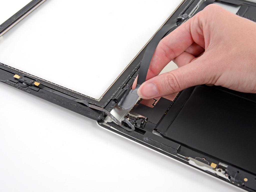 Step 40 Using your fingers, pull the digitizer ribbon cable out of its recess in
