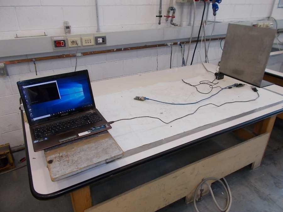 discharges from operators directly and to adjacent objects. The table-top equipment under test is placed on a wooden table, 0.