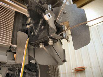 Using vise grips, clamp in place to the bottom of the frame rail. Do this to both sides of the vehicle.