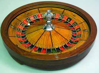 217. VINTAGE MAPLE AND WALNUT ROULETTE WHEEL, early 20 th Century, made by H.