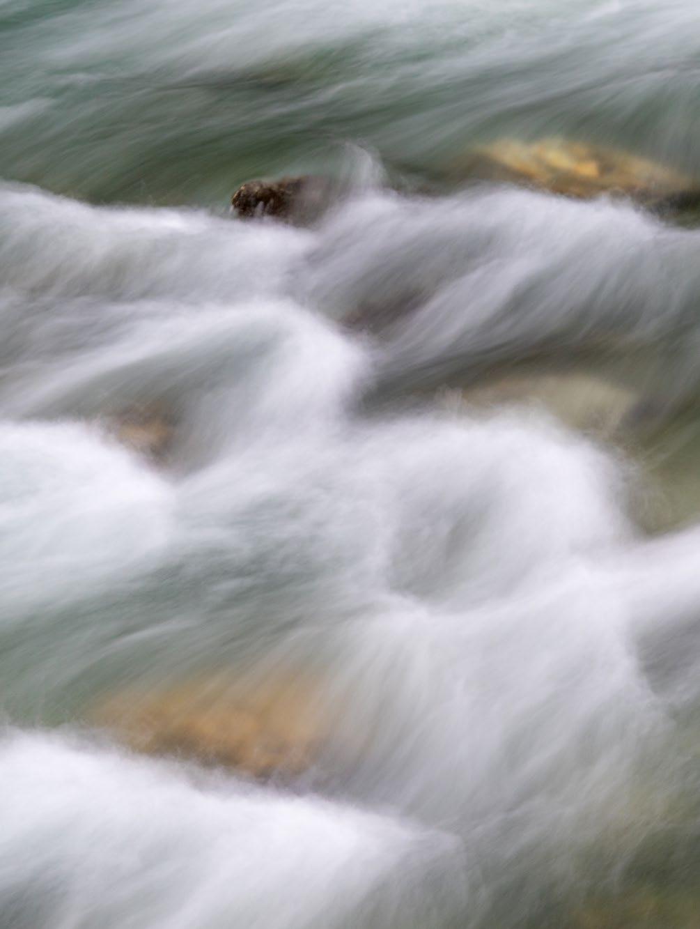 A long exposure produces interesting textures in a fast moving Alpine stream.