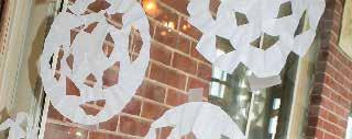 Coffee Filter Snowflakes coffee filters scissors Fold a coffee filter in half three times.