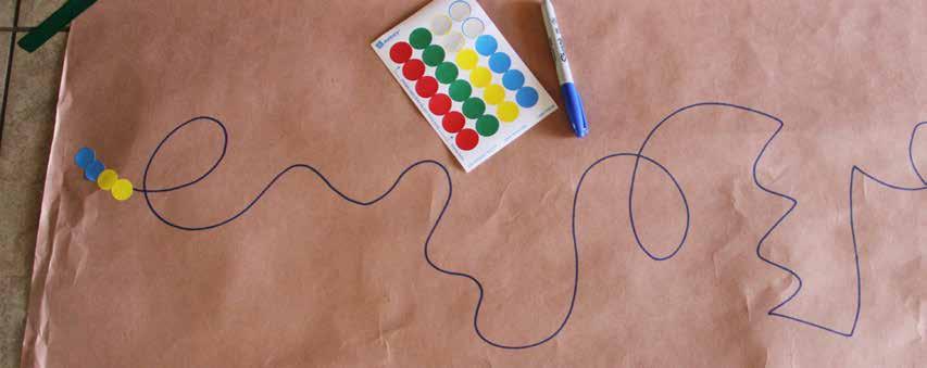 Dot Sticker Designs stickers butcher paper marker tape Tape down a large piece of paper.