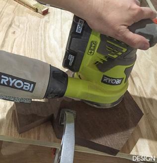 7 Using an orbital sander, starting at about 80-grit sandpaper, sand the wood smooth.