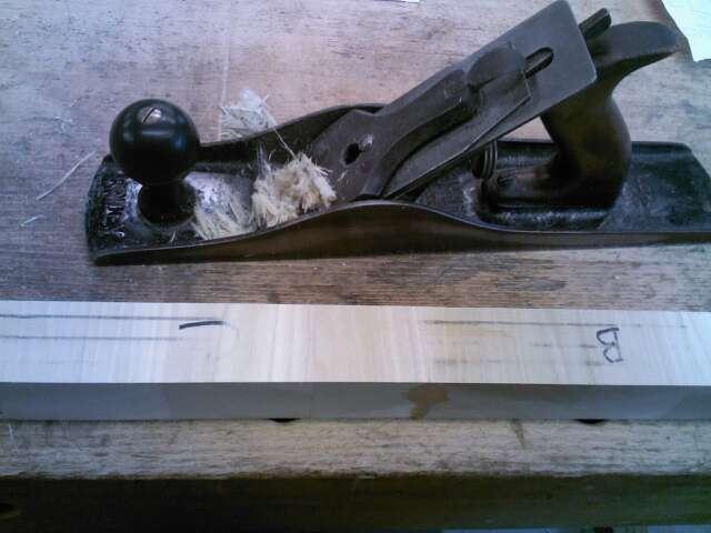 Take a hand plane and flatten one side of the laminated strip.