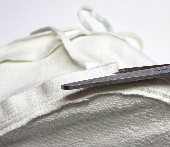 Clip the seam allowances along the curves of the fabric cap and press open as much as possible.