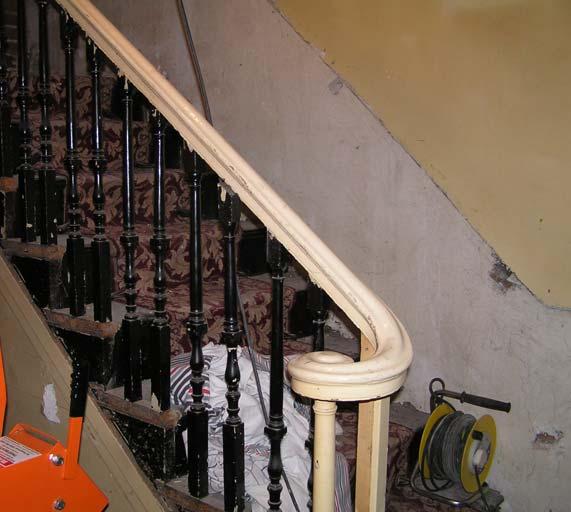 The recent removal of the hard board revealed not simple stick balusters, as might be expected, but standard turned balusters of Victorian date on an open string (fig. 7).