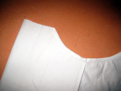8. HEM THE ARMHOLES. Finish the armholes with a ¼ double fold hem. 9. GATHER FRONT AND BACK OF BODY PIECES.