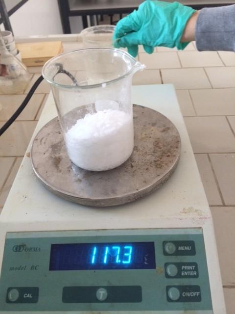 The sodium hydroxide is weighed accurately, then it will be dissolved in a
