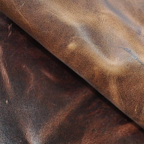 WORN OUT COLLECTION THIS DISTRESSED LEATHER APPEARS FLAWED, BUT