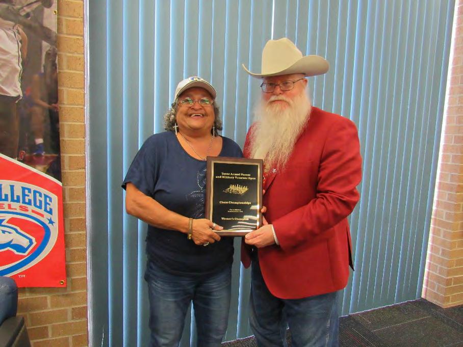 Air Force/Marines Retiree Clarese Roberts (left in the photo) was crowned Texas Armed Forces Women s Champion by Jim Hollingsworth (right), Chief Organizer.