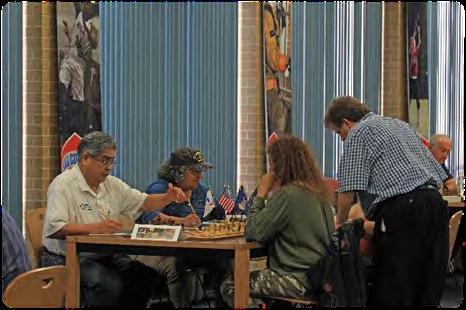 Jedwayne Bowser (left), from Grand Prairie and playing in his first rated tournament, won the Texas Armed Forces Unrated Chess Champion title.