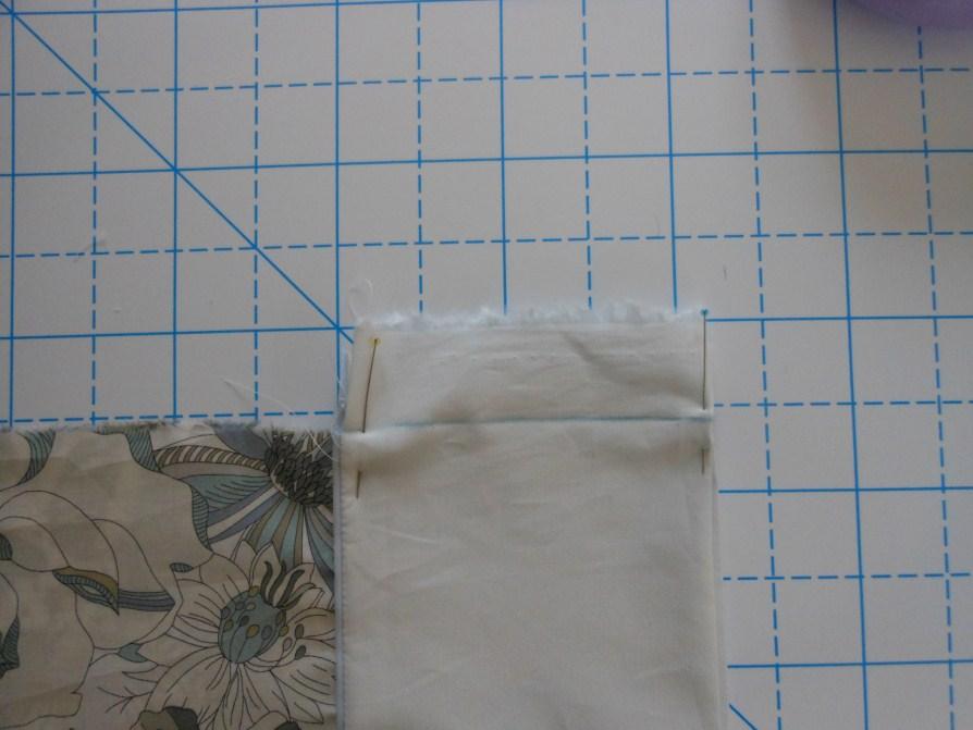 Use a straight edge to continue the edge of the fabric.