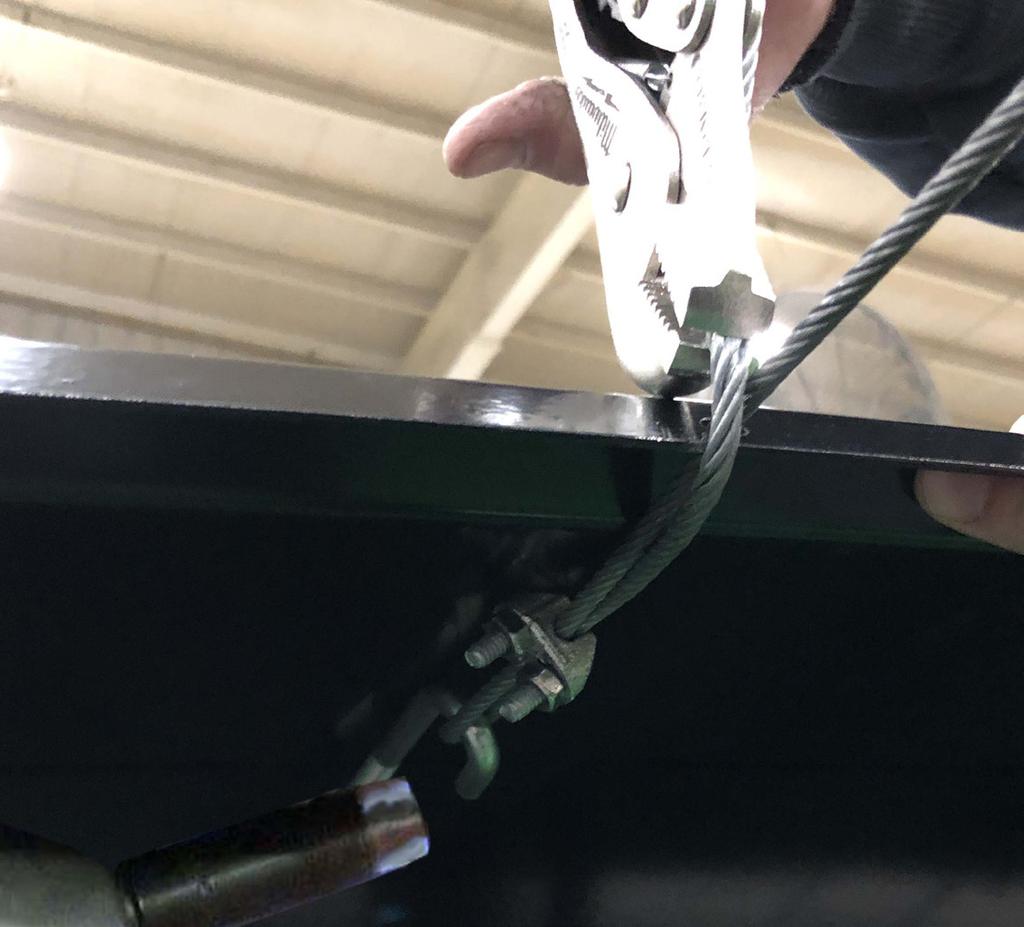 Installing Cable Clamps Using a cable clamp, feed one end of the cable through the cable clamp, make a small loop, then tighten the cable. Do this with all three cables.