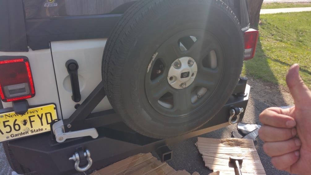 space between the tire, and carrier. 12. Finally, remount your spare tire, and secure down with lugnuts.