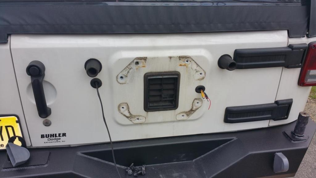 light wire. You can remove the rubber grommet, stuff the wire into the tailgate, and get the grommet 95% back in to protect everything) 8.