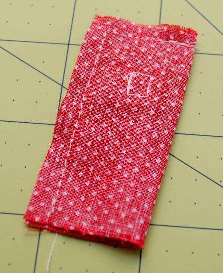 Fold the tab fabric over right sides together and sew along one short edge and the