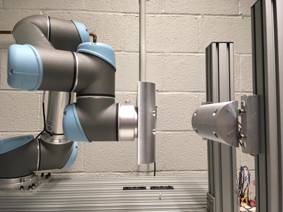 Task 5: In this task, the robot is equipped with an aluminum semi-cylinder as its end effector as seen on the left side of Figure 10.