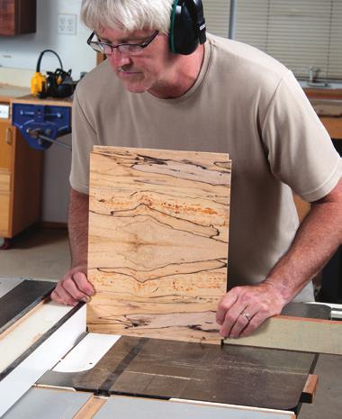 After edge-gluing the pieces to create the 6" width, squarely crosscut the panel to 4" long, and then sand it to snugly fit the tray grooves.