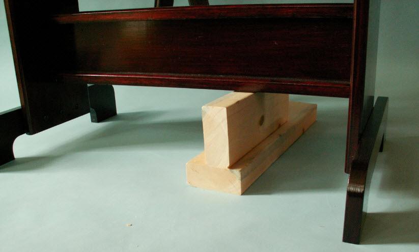 28. Take the assembled I-Beam and raise it between the two legs of the saddle stand, resting the I-Beam on two 2 x 4s, one horizontal and one vertical