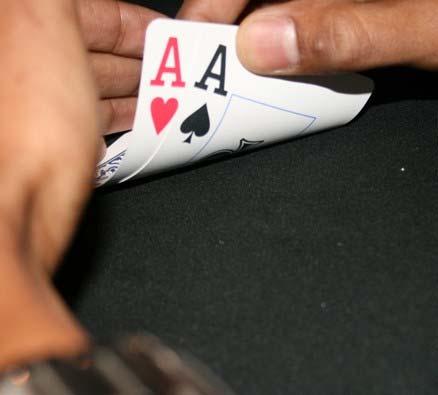 Cards are dealt and the players have to know when to hold em, know