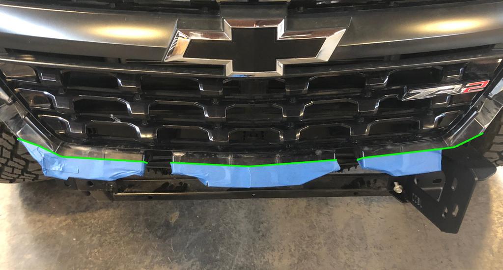 Grille will be placed back onto the vehicle once the new bumper is secured to vehicle.