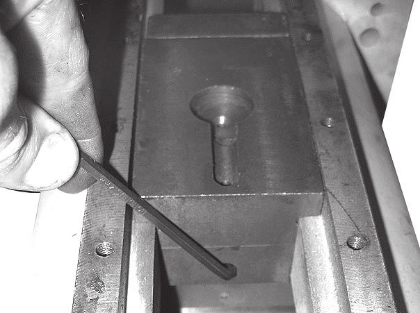 7. Using a 4mm hex wrench, loosen the slide block set screw. (Figure 7). 10.